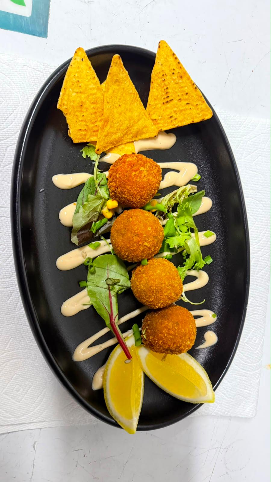 Truffled porcini arancini served at Illumina Bar