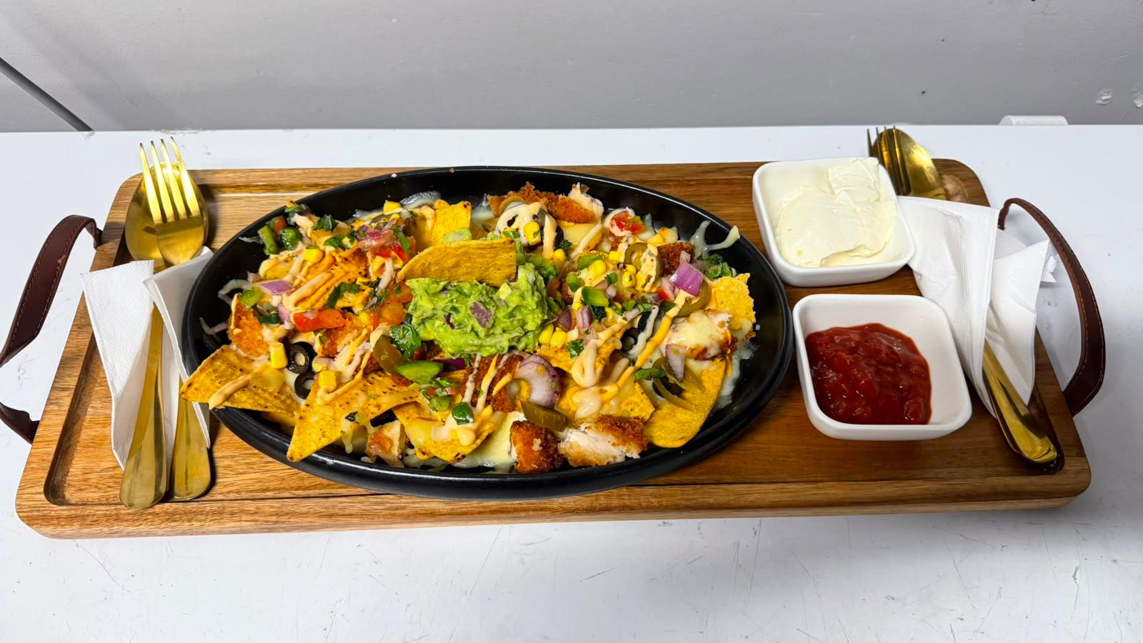 Loaded nachos served at Illumina Bar